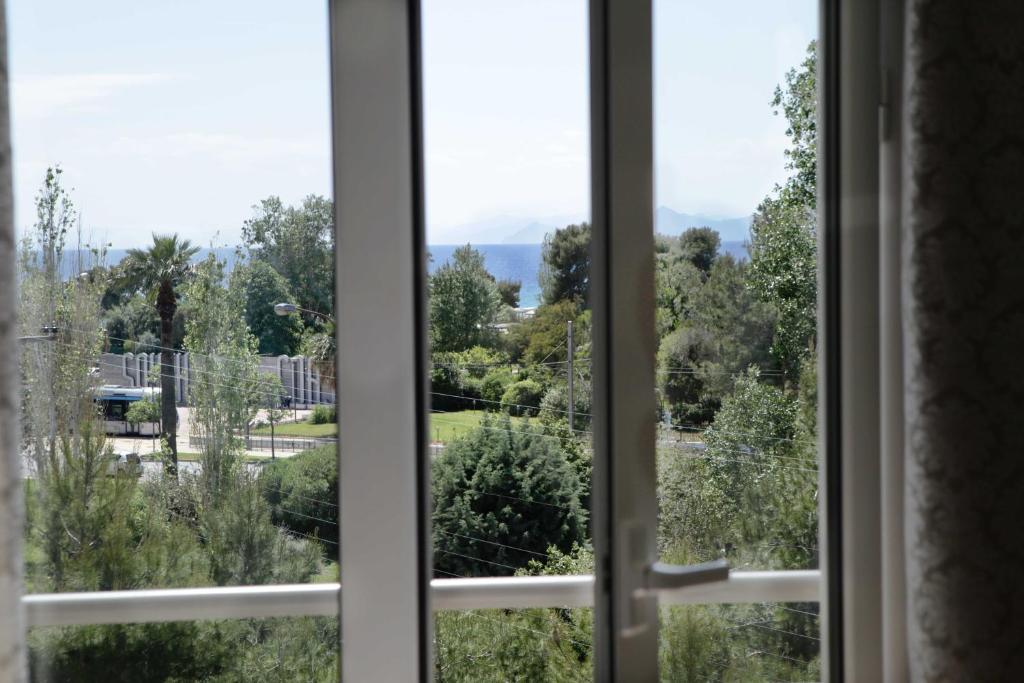 Четырехместный (Улучшенный четырехместный номер), Minavra Hotel