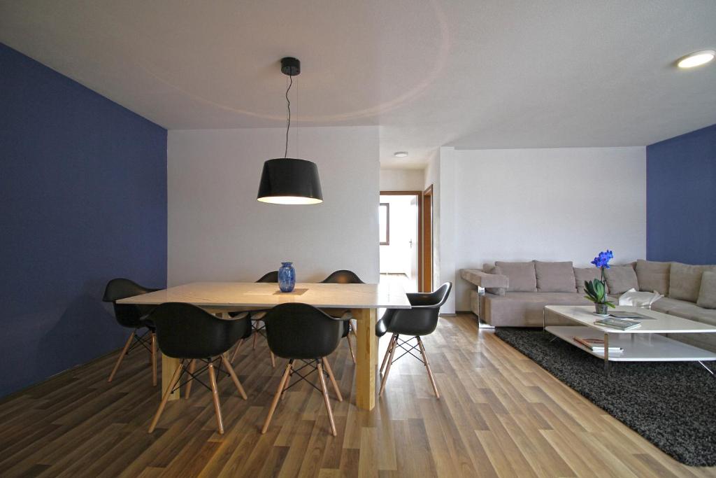 Blue apartment over Prizren roofs