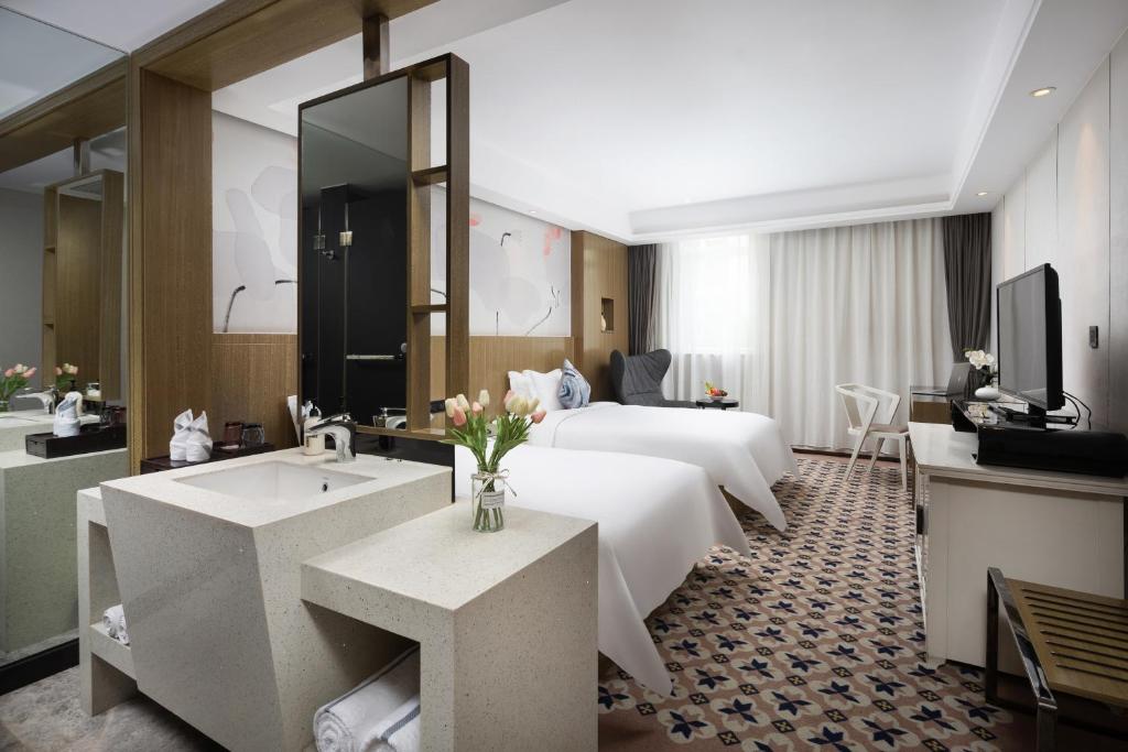 Двухместный (Двухместный номер Делюкс с 2 отдельными кроватями), Paco Business Hotel West Longkou Road Branch