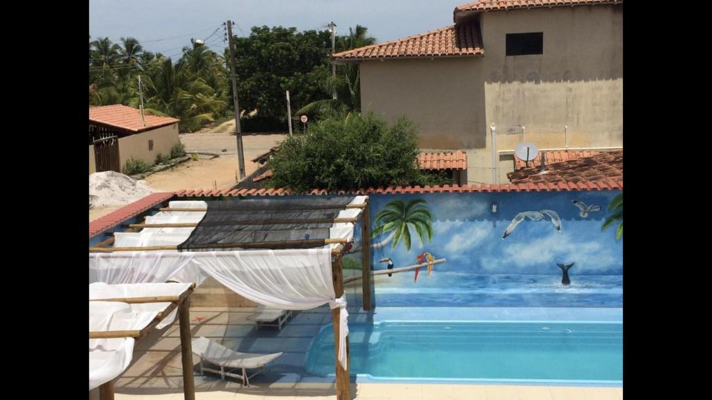 Casa Temporada Frente à Praia Piscina Ar cond Nova Viçosa VA