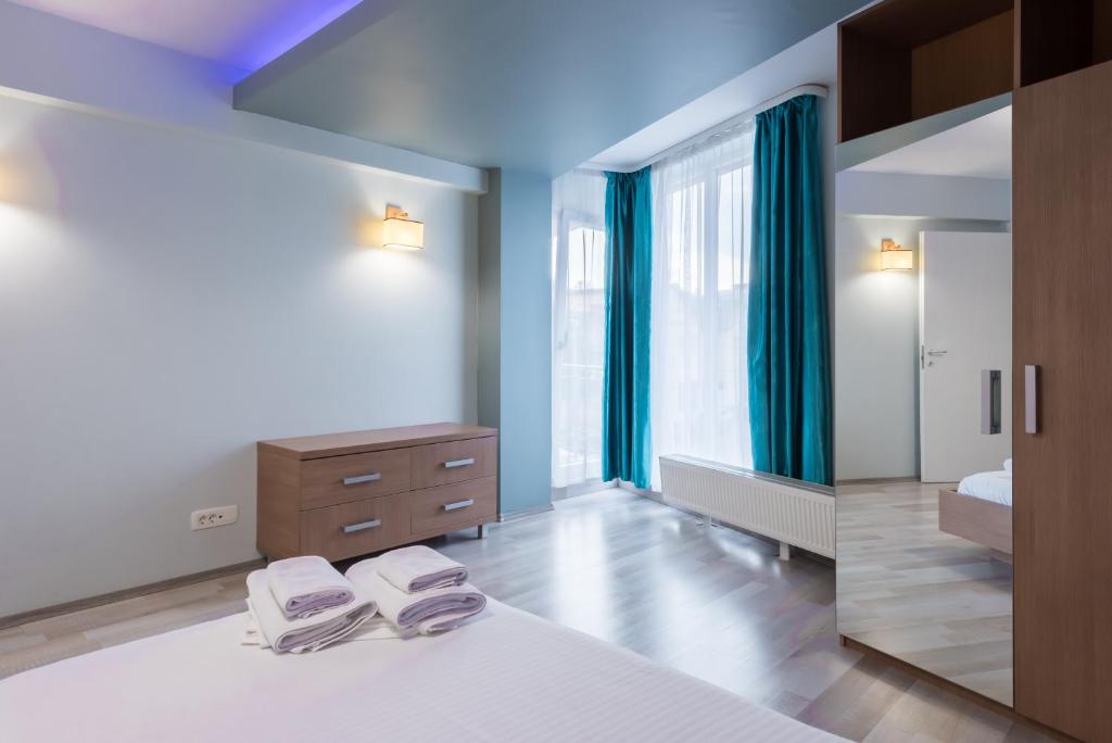Апартаменты (Апартаменты Делюкс с 3 спальнями), Downtown Accommodation