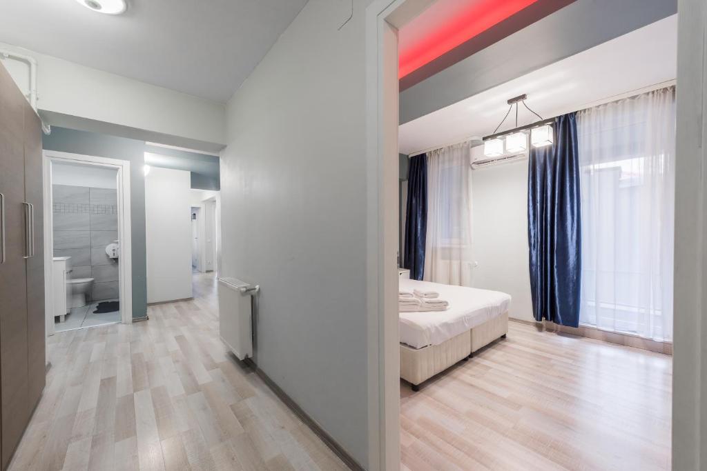 Апартаменты (Апартаменты Делюкс с 3 спальнями), Downtown Accommodation
