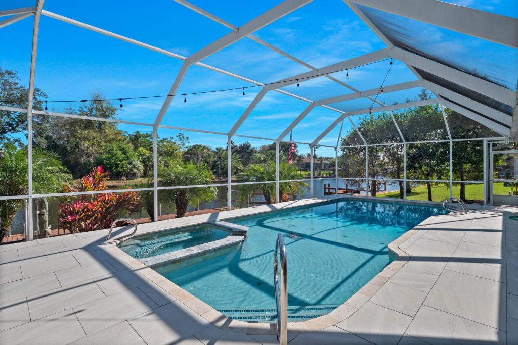 SALTY TURTLE Luxury Salt Water Pool Home on Salt Water Canal with Tiki Bar image