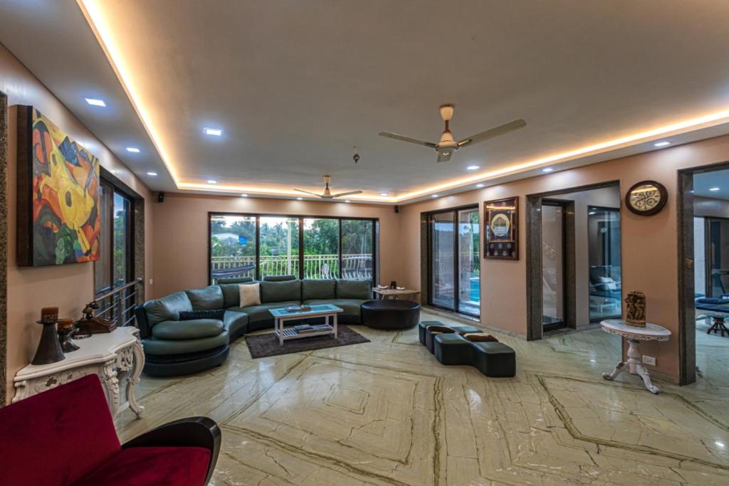 SaffronStays Aura, Alibaug - luxury pool villa with a game room and spacious lawn photo 1