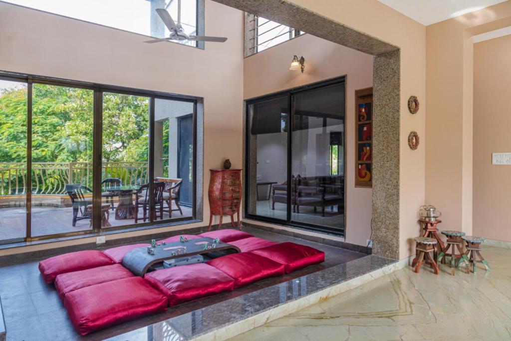 SaffronStays Aura, Alibaug - luxury pool villa with a game room and spacious lawn photo 3