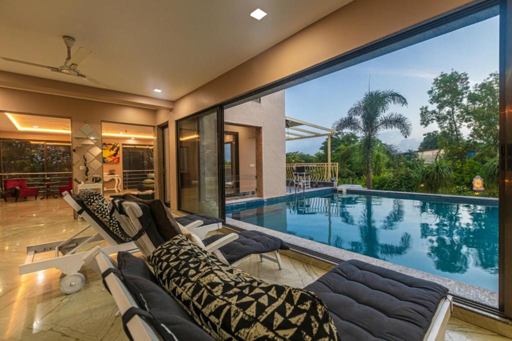 SaffronStays Aura, Alibaug - luxury pool villa with a game room and spacious lawn photo 2