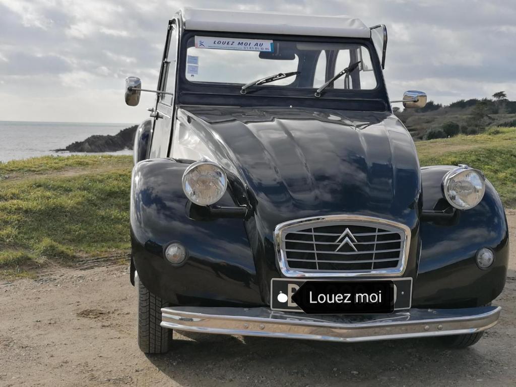 Proche mer, cadre verdoyant avec parking photo 1