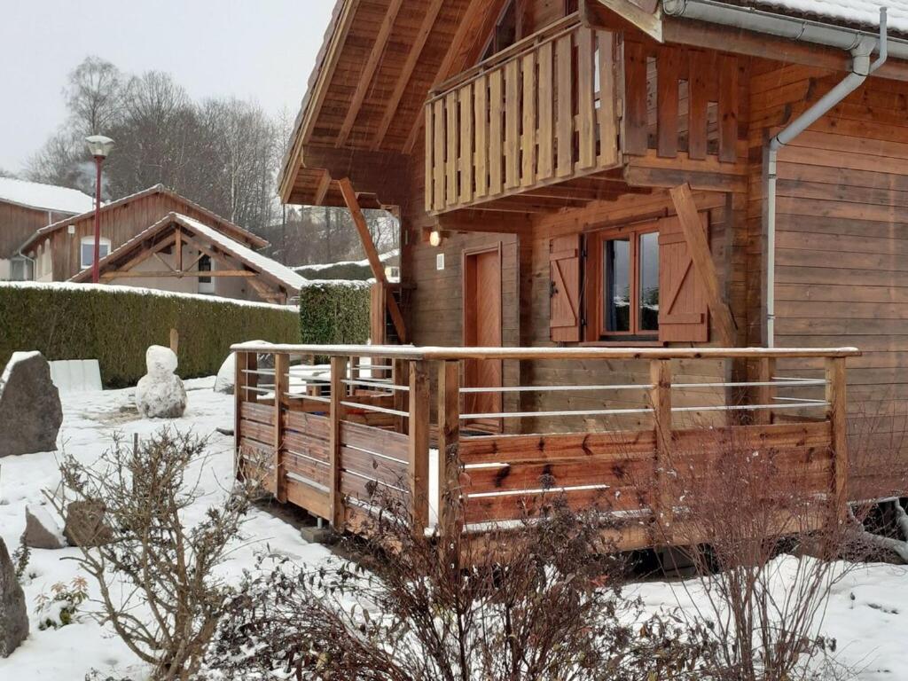 Wooden chalet in Vosges by a pond photo 1