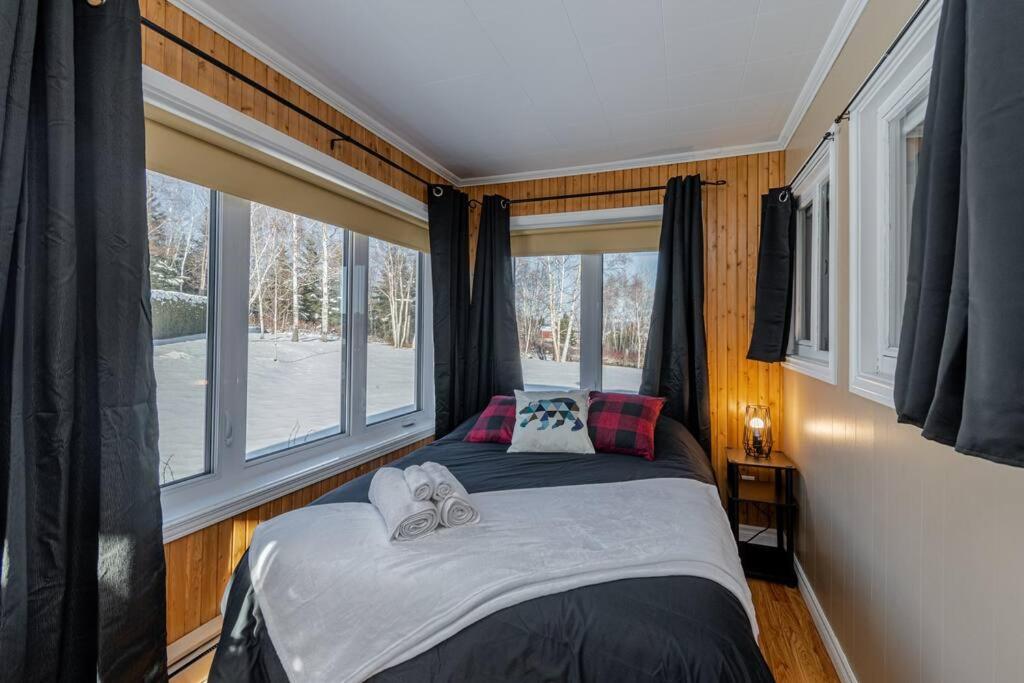 Spa, sauna et foyer : Le Phare de Baie-Saint-Paul photo 4
