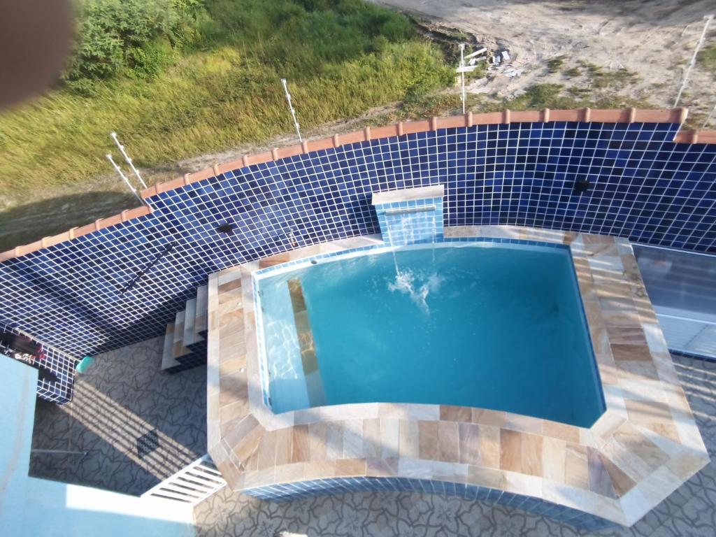 Casa com piscina , churrasqueira, Wi-Fi, em rua de Areia à 1km da praia, bairro sussegado, proíbido uso de som extremamente alto ideal para descansar photo 4