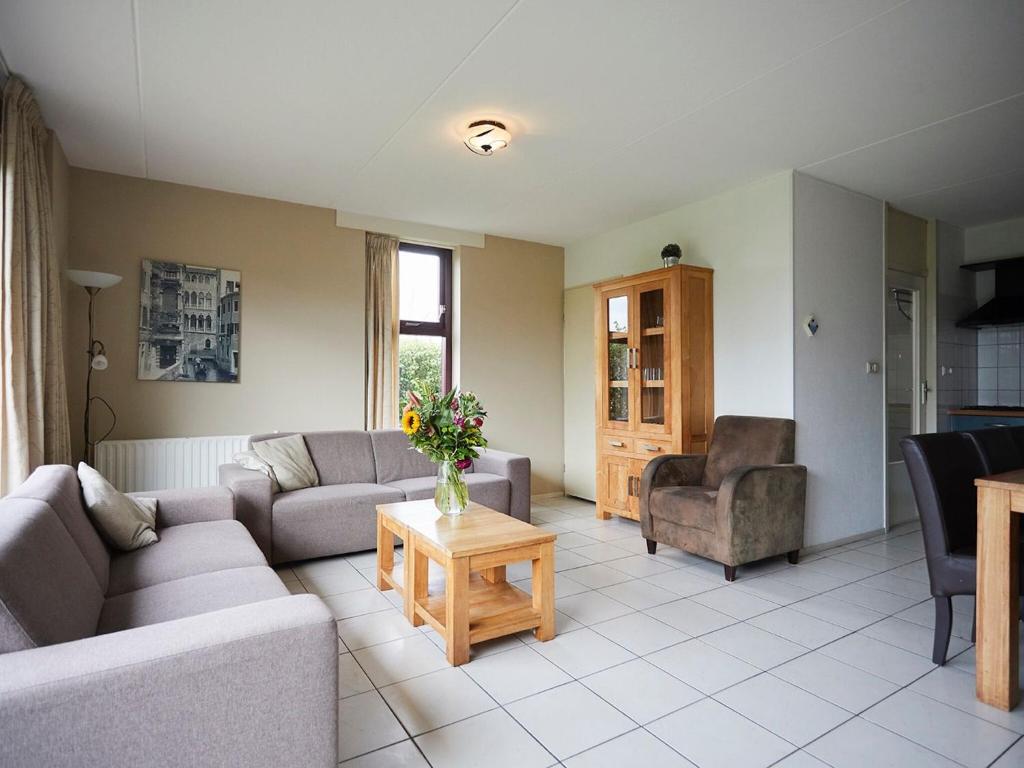 Coy holiday home with large garden, in Zeeland photo 1