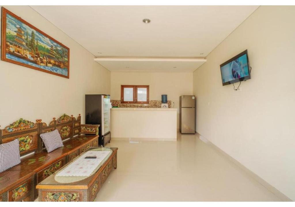 Komala Homestay by ecommerceloka - Tap to explore photos