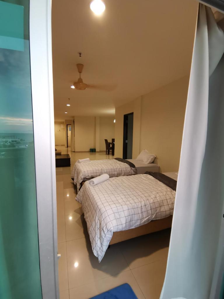 Spacious & Homey Apartment at Marina Island by JoMy Homestay photo 2