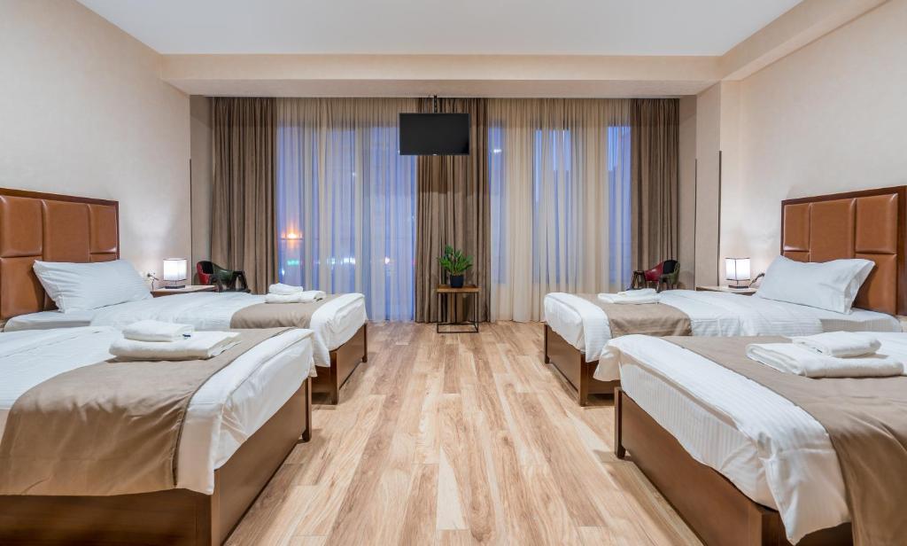 Hotel Aura in Digomi - Tap to explore photos