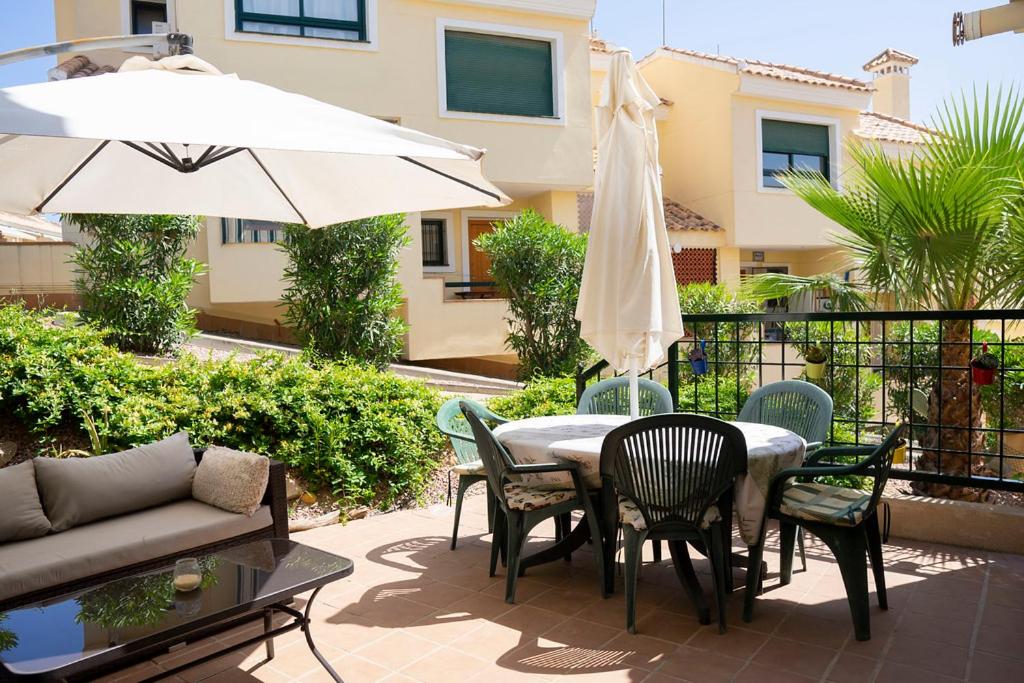 Beautiful Townhouse with views over the communal pool close to Campoamor Golf Course