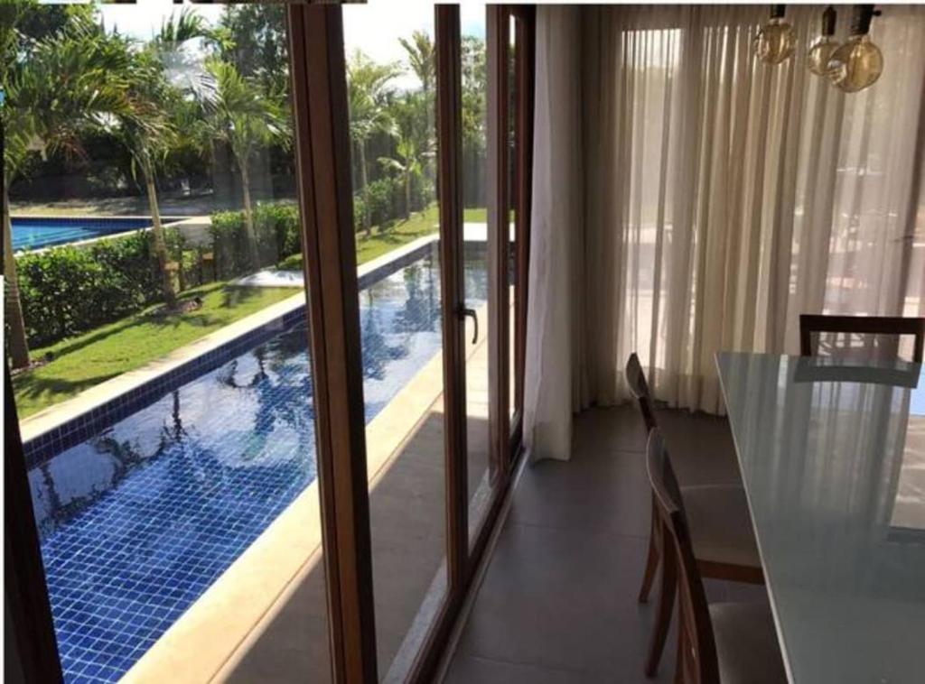 Casa Temporada - 4 suítes - Condomínio Luxo - Piscina Extraordinária - Praia de Itacimirim-BA photo 3