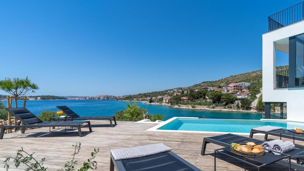 Luxury Seafront Villa Roots with private, heated pool, 5 en-suite bedrooms, enchanting sea views photo 1
