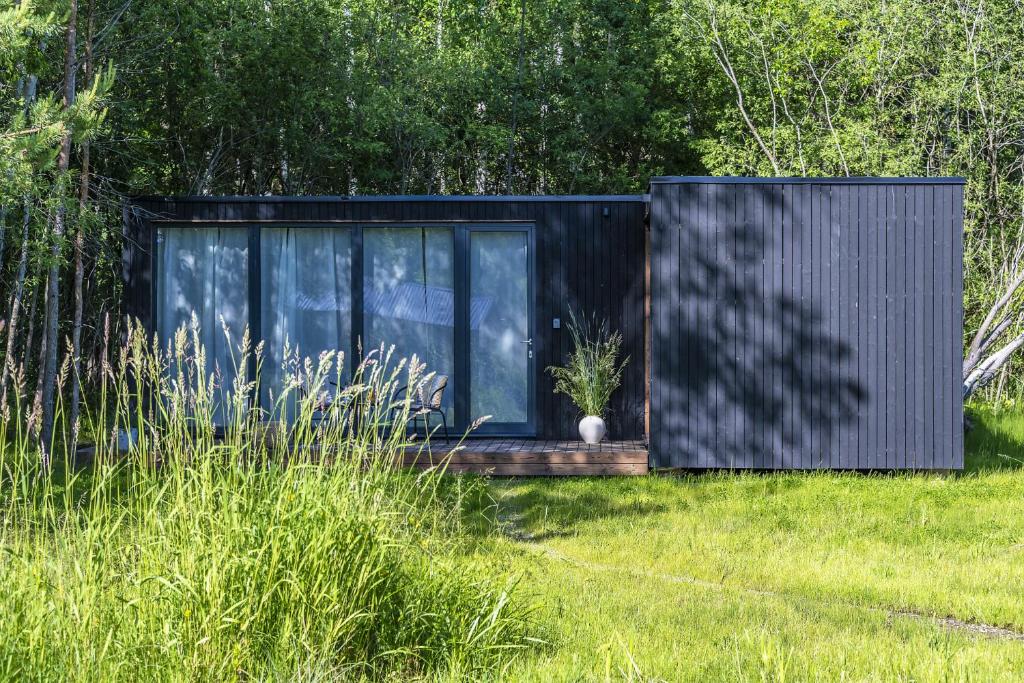 Modern and specious riverside cabin with hot tub photo 1
