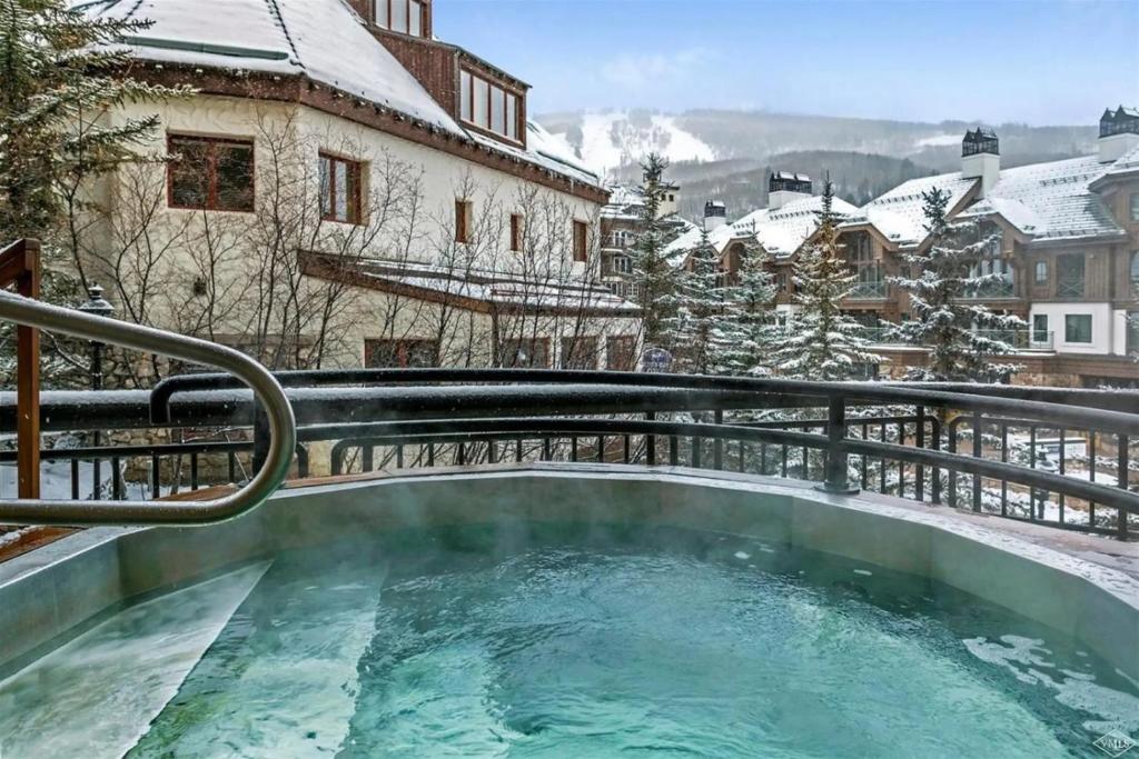 Ski, in Ski out 2 Bedroom Vacation Condo With Resort Amenities That Include Exercise Center, Indoor Pool, and Hot Tubs image