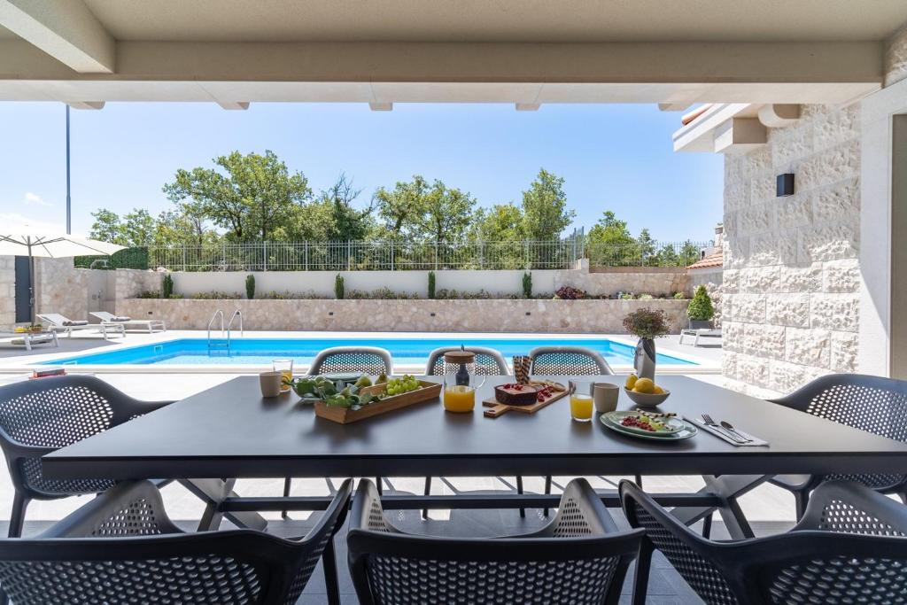 NEW! Stylish Villa Neven with 44sqm heated private pool, 4 en-suite bedrooms, 2 living and dining areas, wine cellar photo 2