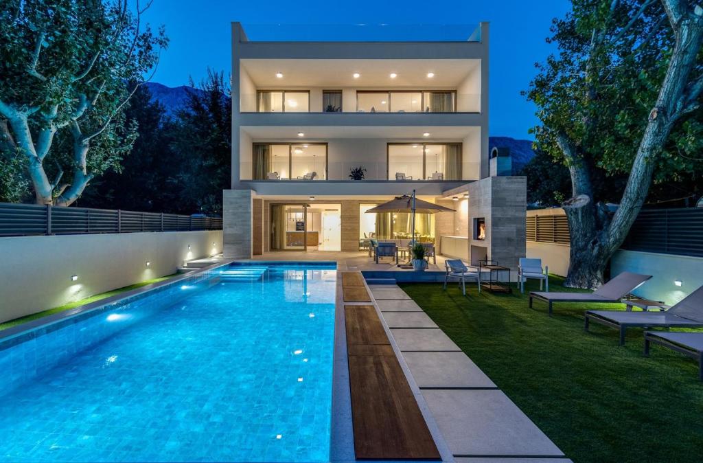 Beachfront Villa Erce with private 40sqm heated pool, a Gym, 7 en-suite bedrooms, a rooftop terrace, 2 living areas photo 1