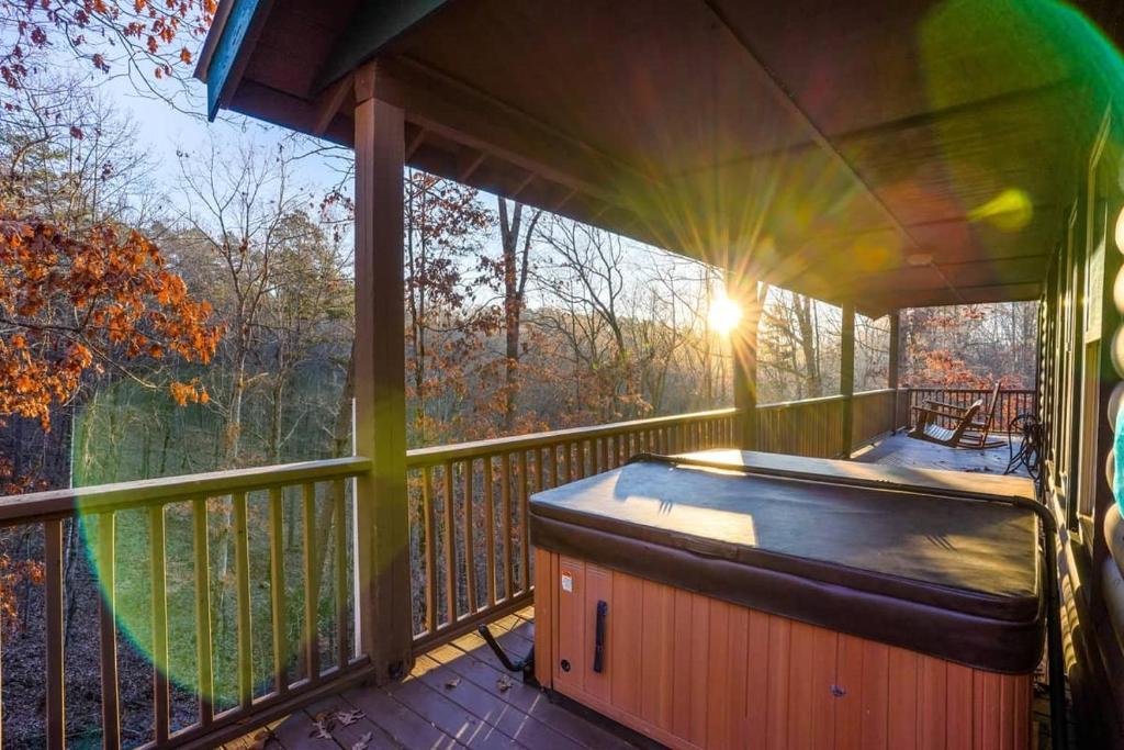 Cozy Creekside Log Cabin w Firepit, Hot Tub, WIFI photo 4