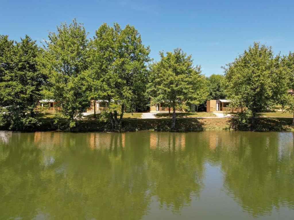 Cottage on the edge of the fishing pond photo 2