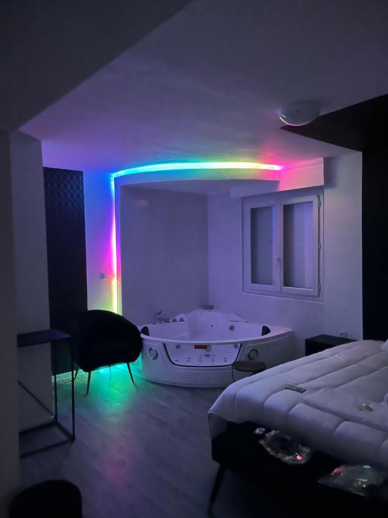 NG SuiteHome - Queven - Balnéo - Netflix - Wifi