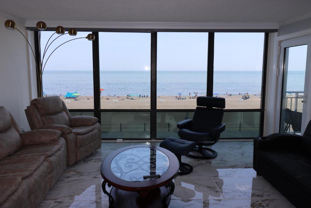 Oceanfront beach, sky, & dolphins photo 3