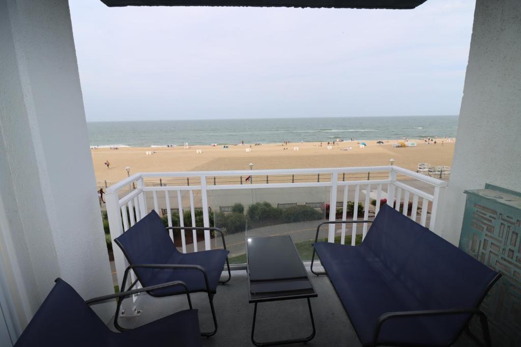 Oceanfront beach, sky, & dolphins photo 2
