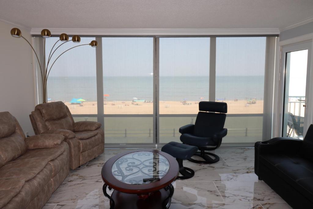 Oceanfront beach, sky, & dolphins photo 4