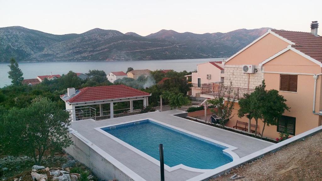 Seaside apartments with a swimming pool Kneza, Korcula - 9269 photo 1