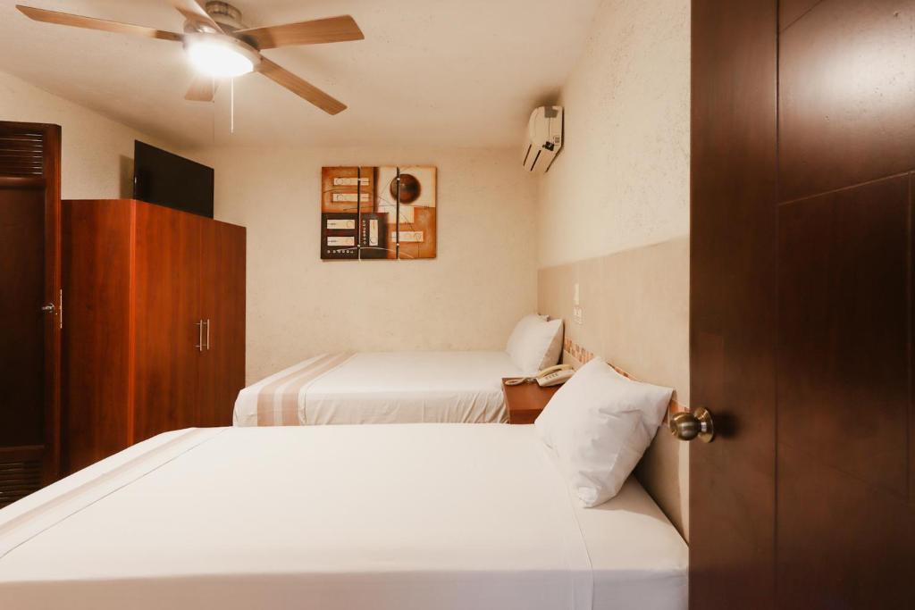 Hotel Guivá Huatulco - Tap to explore photos