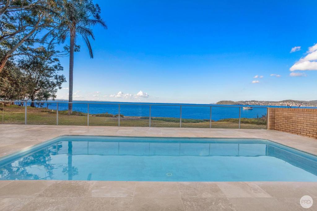 Seaside Sanctuary - Waterfront Luxury Home with Heated Pool photo 1