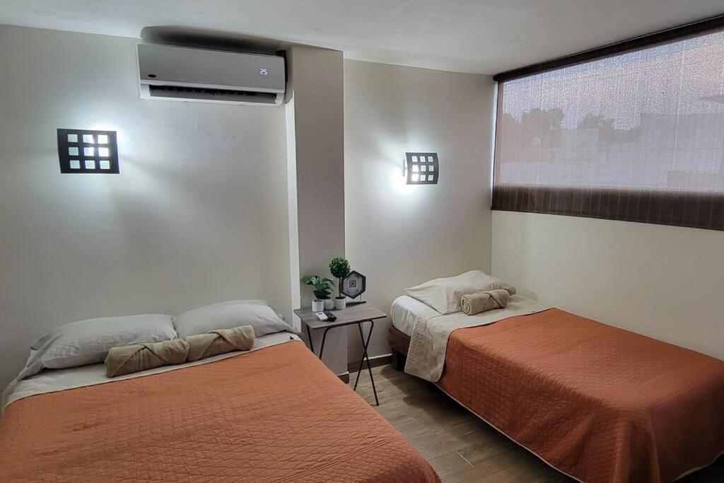 Bonito Departamento con 2 camas con clima, parking, wifi 110mb, ,cocineta, 8