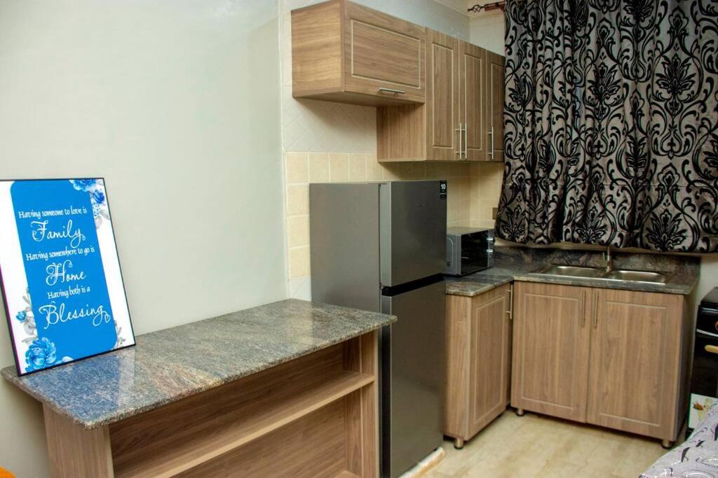 Secure cozy getaway near Kampala business district photo 4
