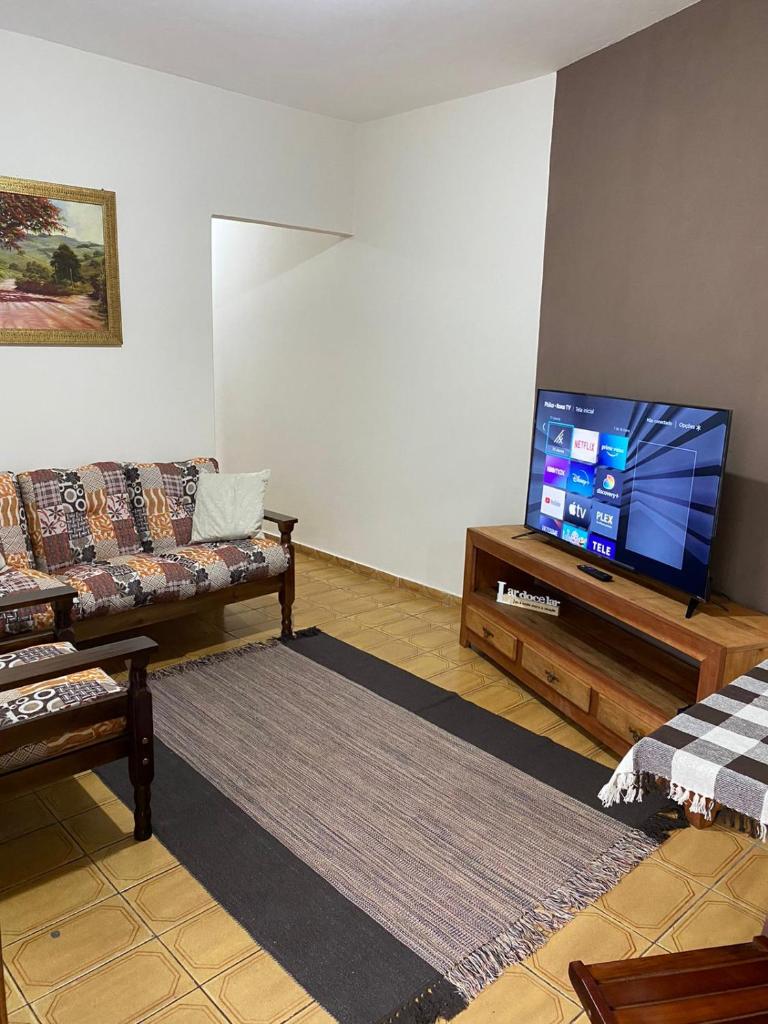 Casa aconchegante à 400m da Praia da Tartaruga - Ar condicionado - WIFI 450MB - Netflix - Cozinha Completa - Garagem photo 1