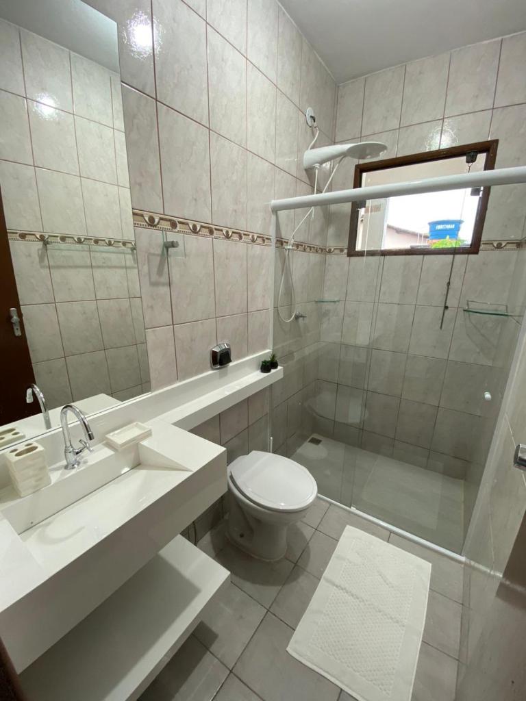 Casa aconchegante à 400m da Praia da Tartaruga - Ar condicionado - WIFI 450MB - Netflix - Cozinha Completa - Garagem photo 3