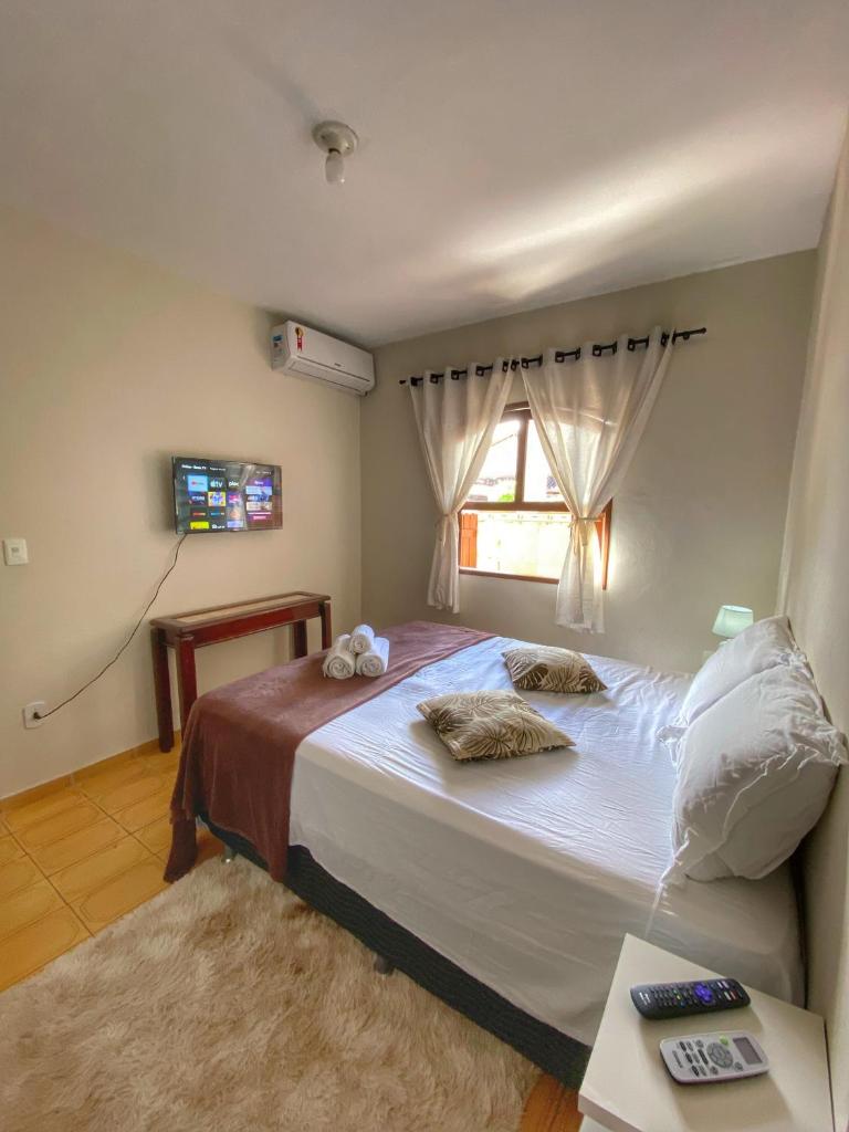 Casa aconchegante à 400m da Praia da Tartaruga - Ar condicionado - WIFI 450MB - Netflix - Cozinha Completa - Garagem