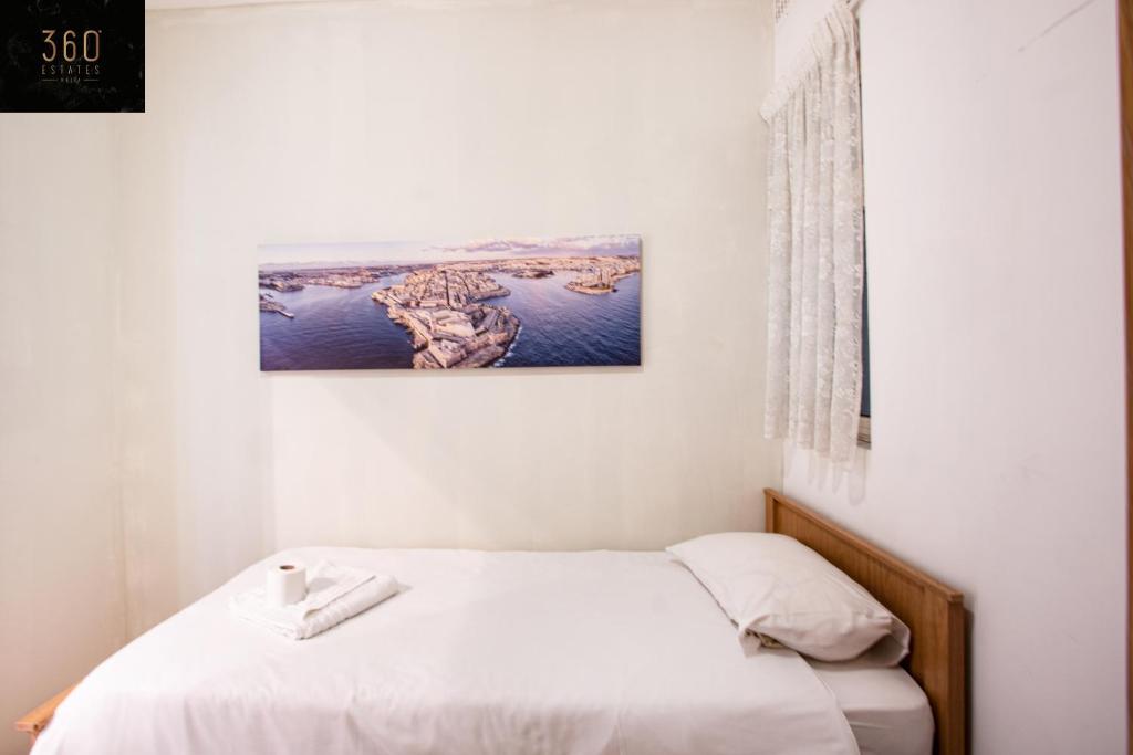 Sliema Seafront 3BR - opposite Beach - AC & Wifi by 360 Estates - Tap to explore photos