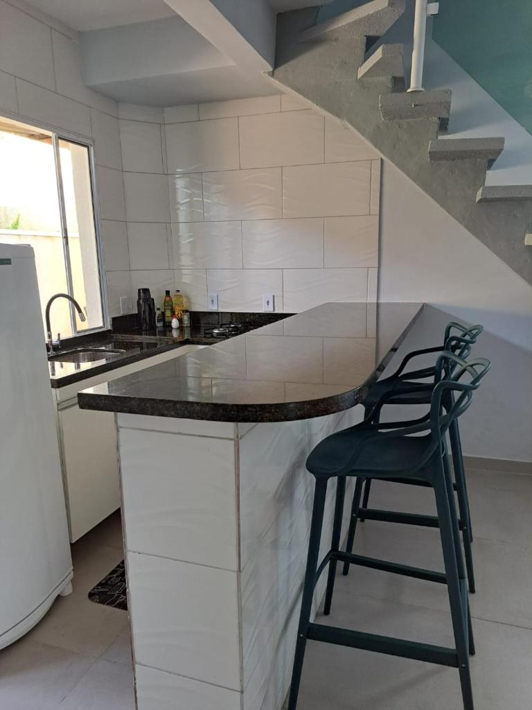 Casa nova com 3 quartos, equipada com Ar Condicionado, TV, Internet e Área de Lazer Completa - Boiçucanga photo 4