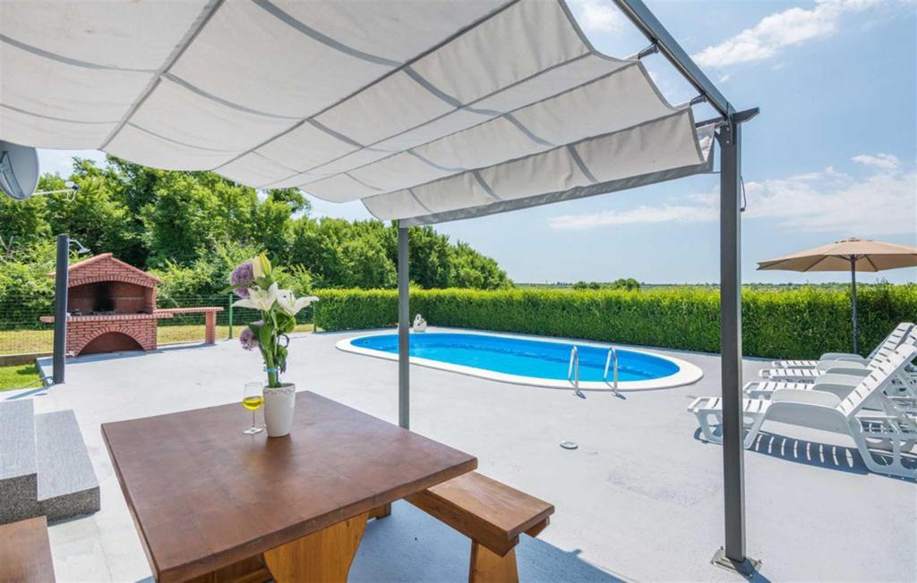 Holiday Home Flora with pool photo 1