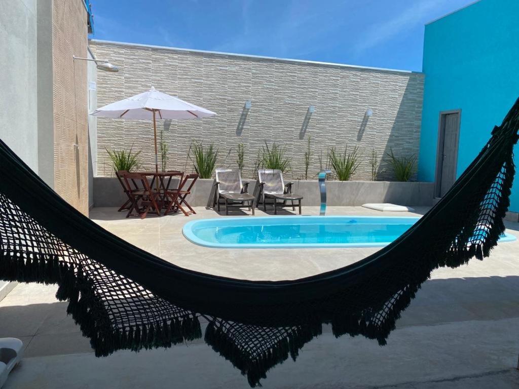 Casa com piscina e um quarto com ar split pé na areia a 50 metros da praia photo 3