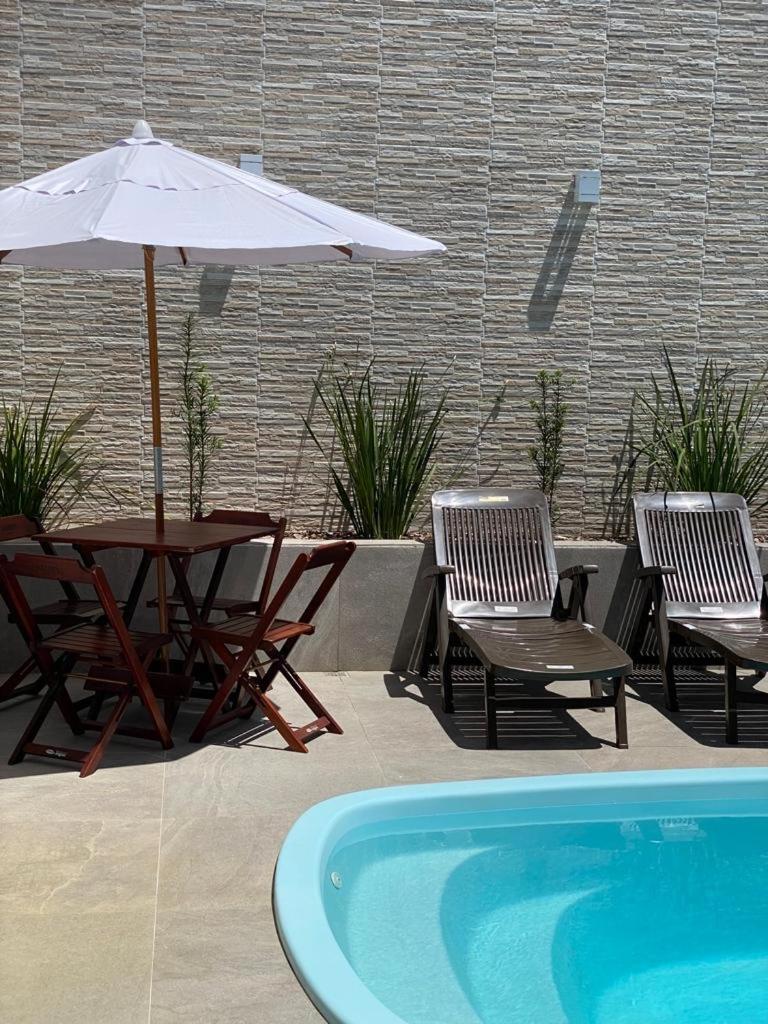 Casa com piscina e um quarto com ar split pé na areia a 50 metros da praia photo 1