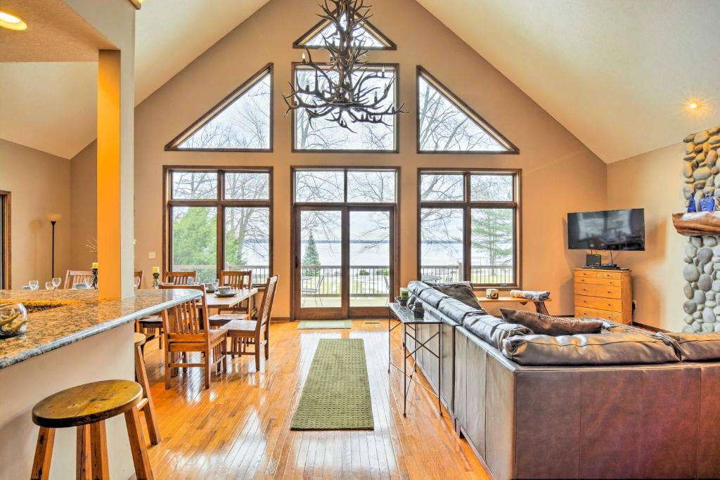 Lakefront Roscommon Home with Dock, Patio, and Games! photo 1