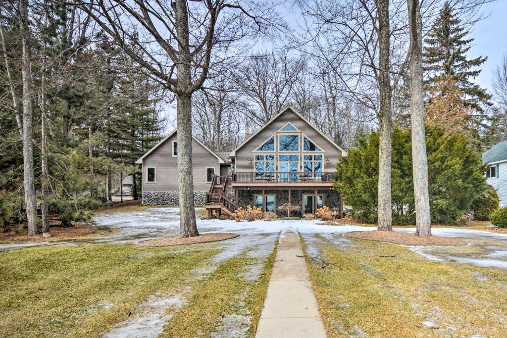 Lakefront Roscommon Home with Dock, Patio, and Games! photo 3