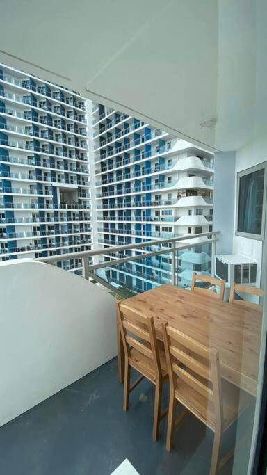 Two Bedroom with Balcony by The Bali Corner at Azure North , POOL and BEACH VIEW - unit with Bathtub