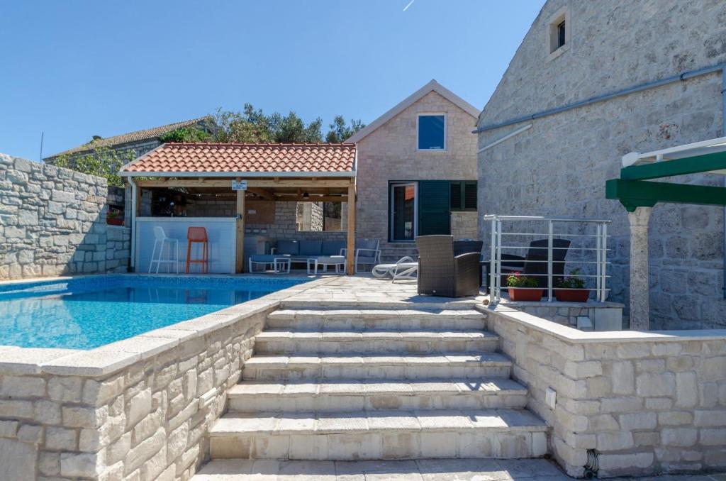 Traditional stone house with swimming pool photo 1