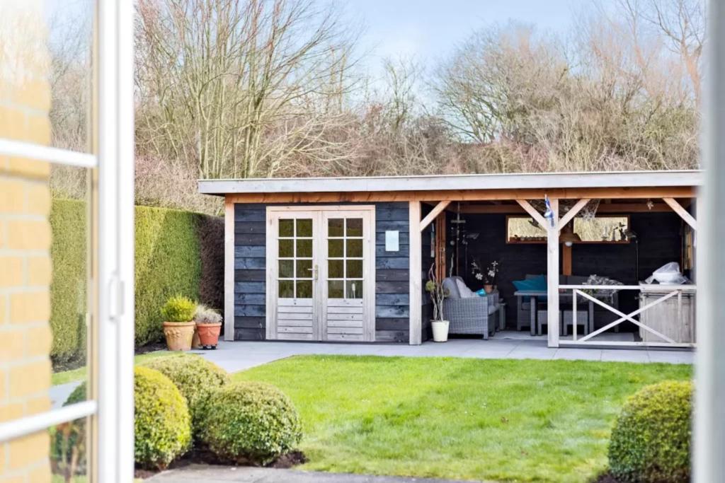Vakantiehuisje met Luxe Tuin dichtbij het strand photo 3
