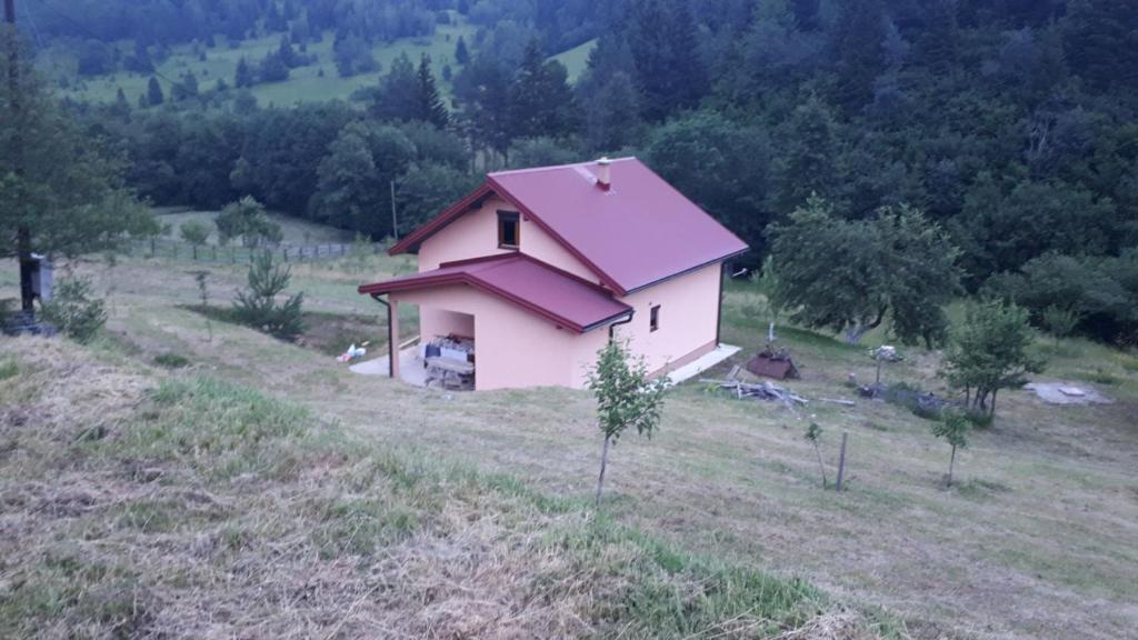House with big garden next to the mountain river